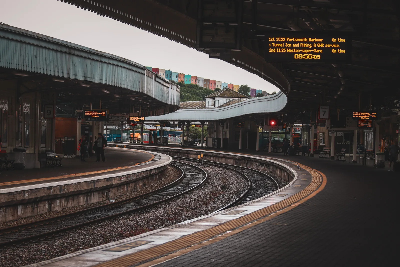 Train station platform with curved tracks