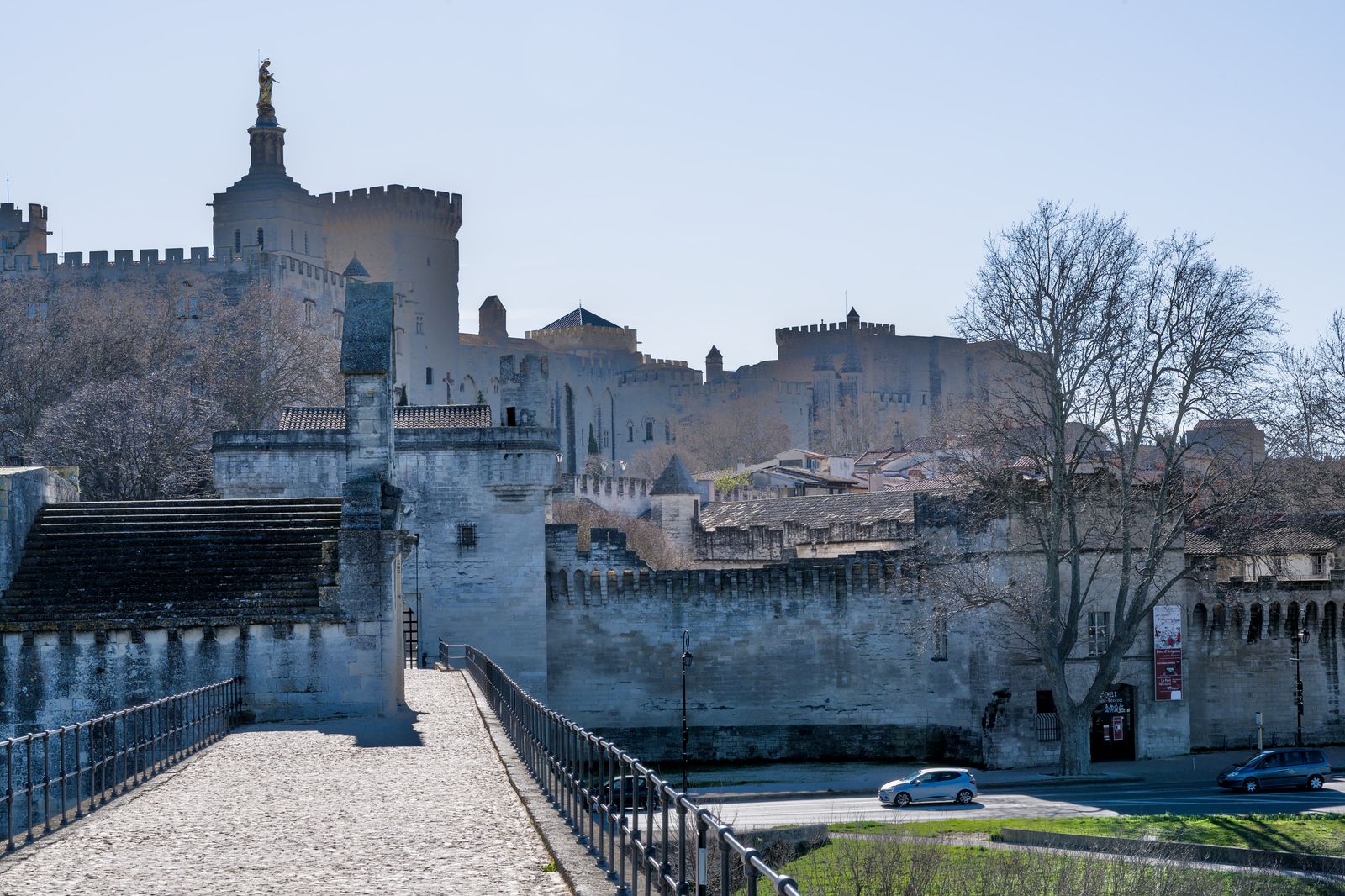 Avignon's historic fortifications and Palais des Papes seen from Pont Saint-Bénézet.