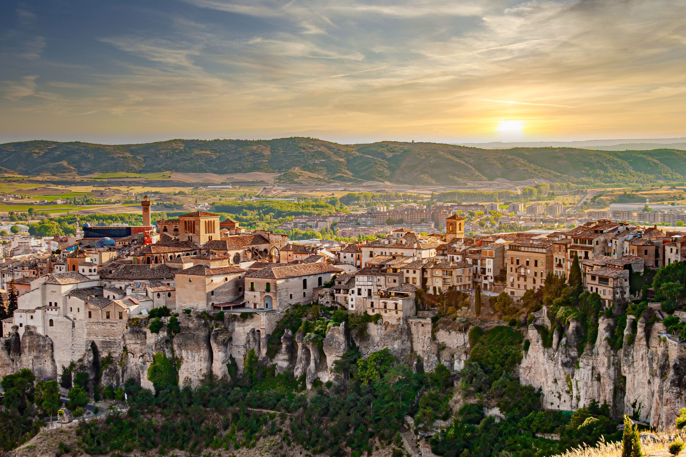 Cuenca's old town on top of limestone cliffs at sunset