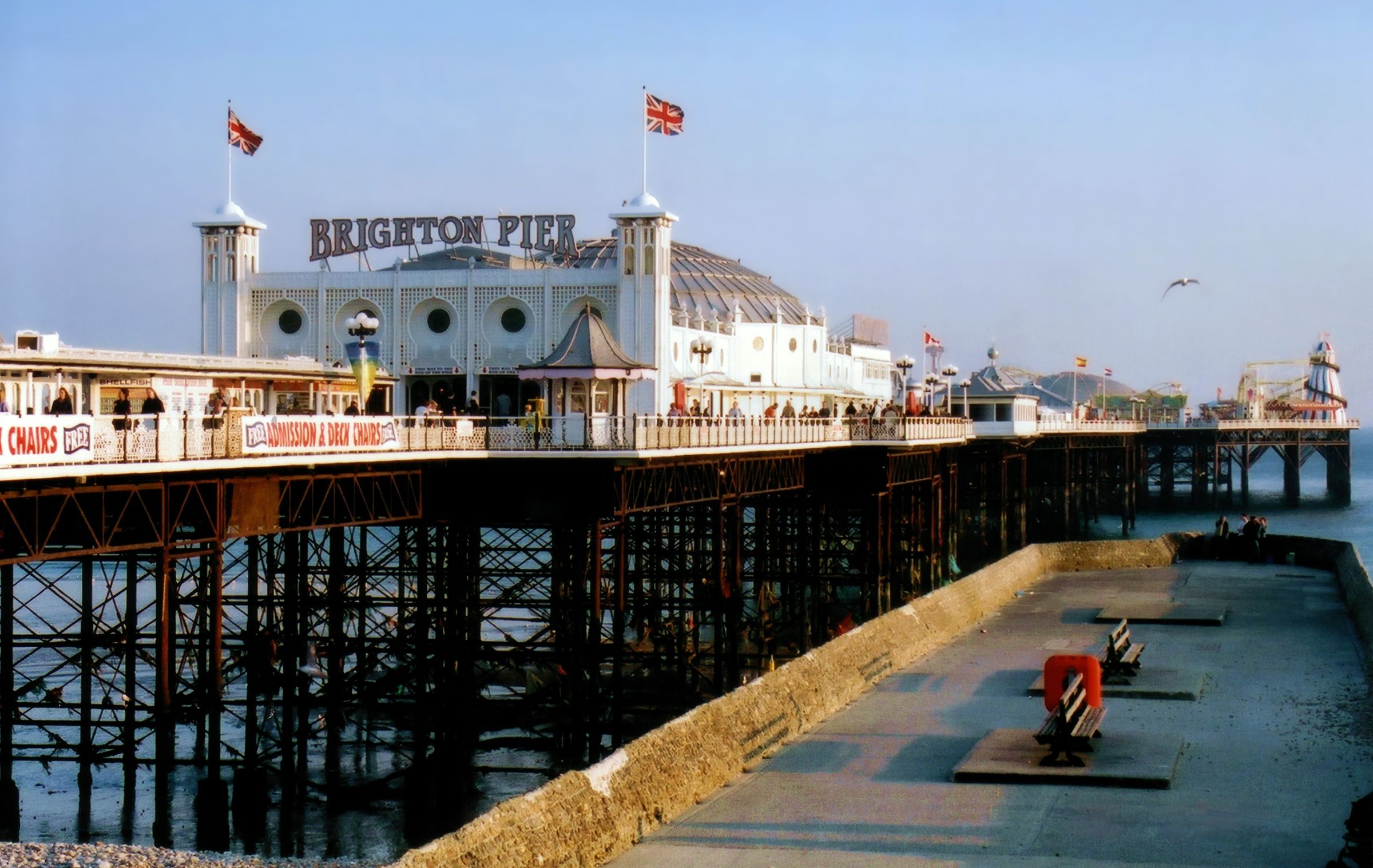 Brighton Pier seen from the seafront on a sunny day